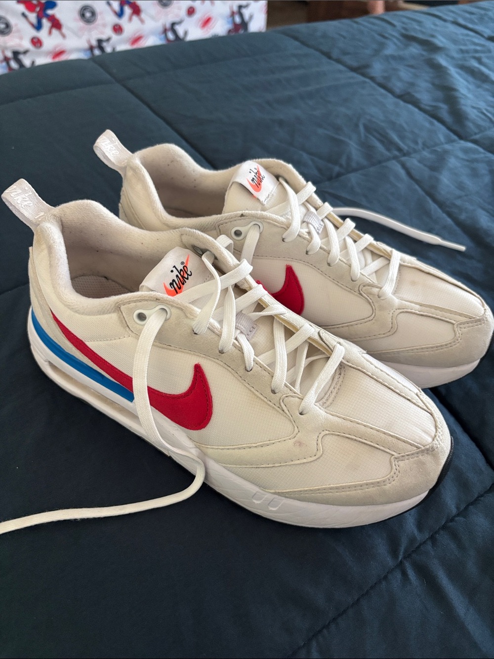 Nike White Sneakers with Red Swoosh and Blue Accent